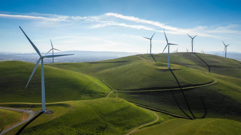 Wind turbines on green hills