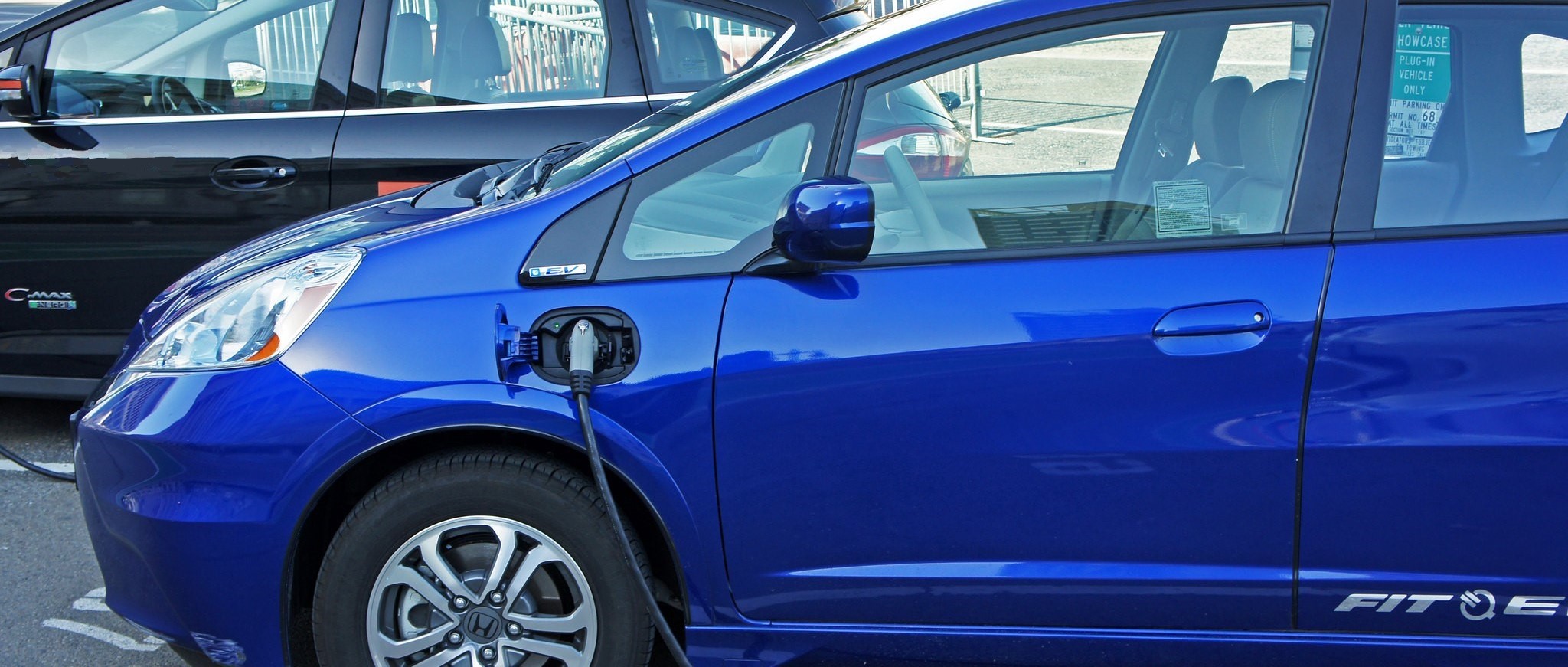 image of blue car charging
