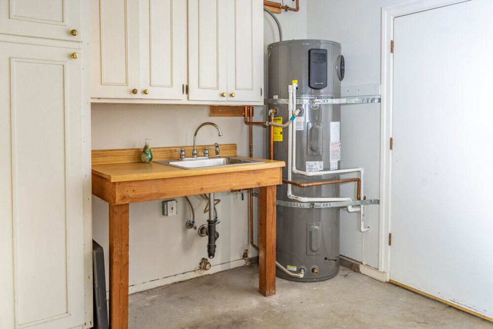 image of a heat pump water heater in a garage