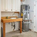 Image of a heat pump water heater in a garage