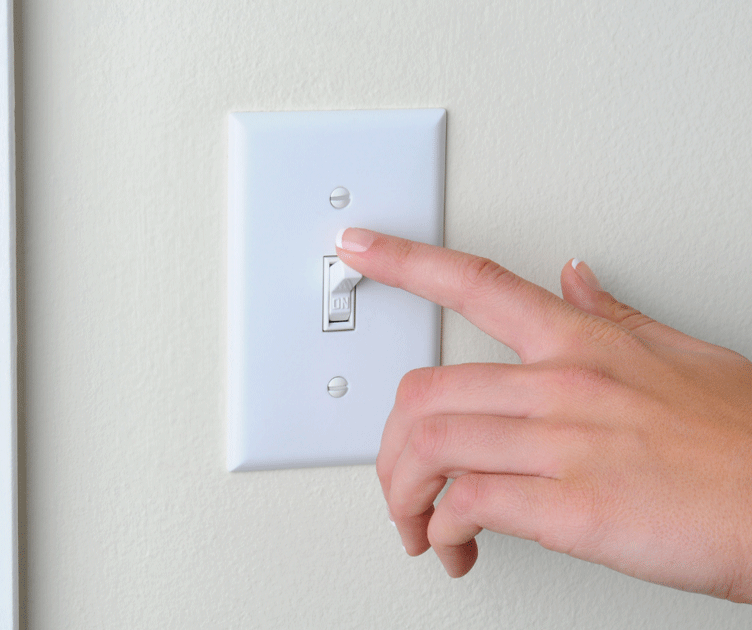 hand on light switch